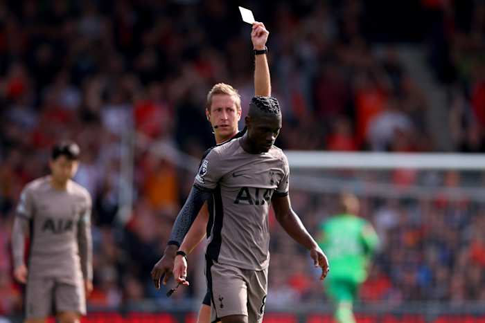 Tottenham Hotspur midfielder Yves Bissouma pictured receiving a card during his team's game against Luton Town in October 2023
